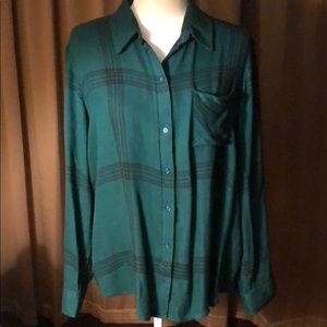 Green long sleeved button up shirt with pocket